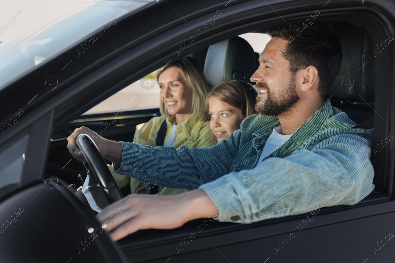 Photo of Happy family enjoying trip together by car, view from outside