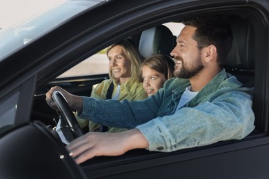 Happy family enjoying trip together by car, view from outside