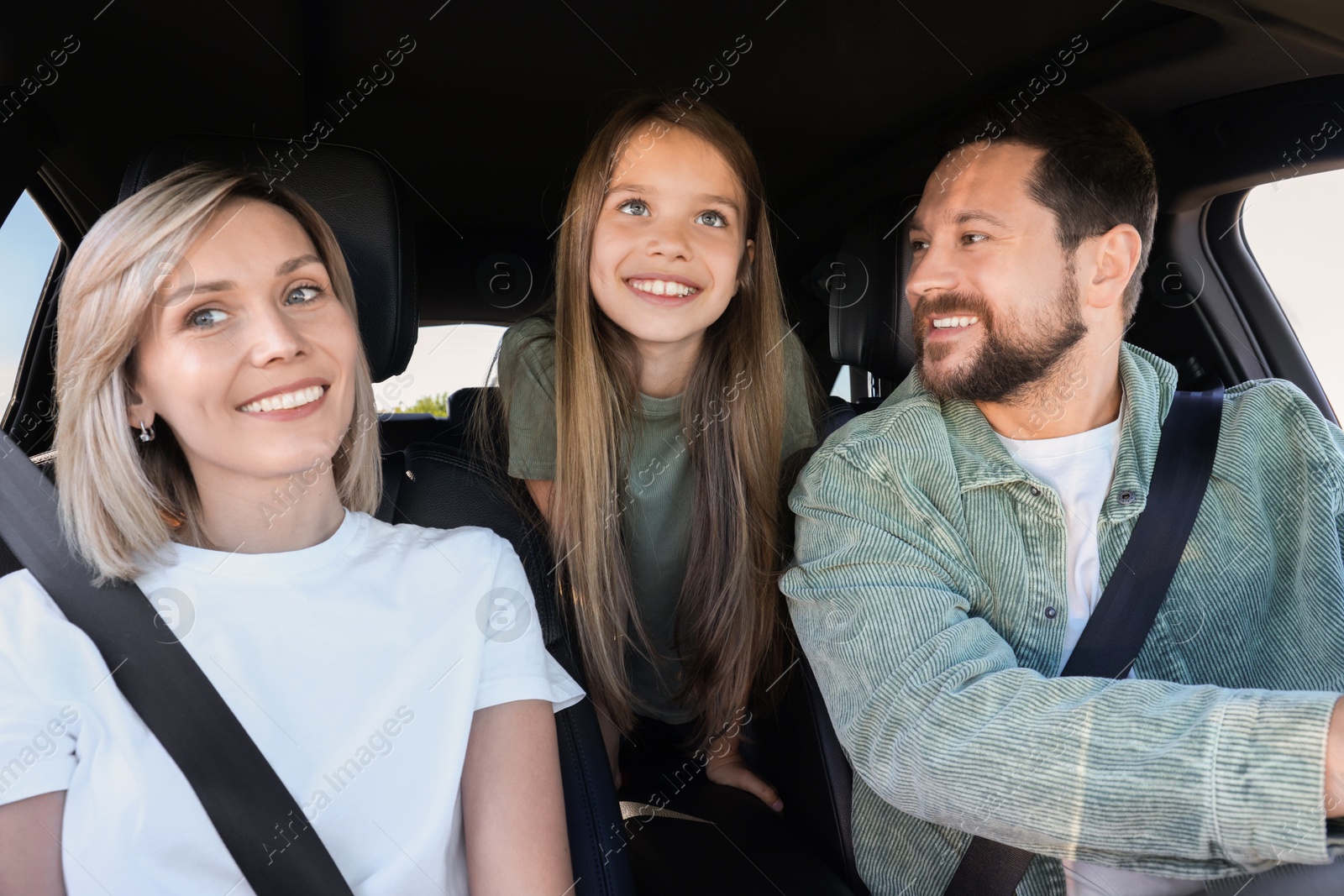 Photo of Happy family enjoying trip together by car, view from inside