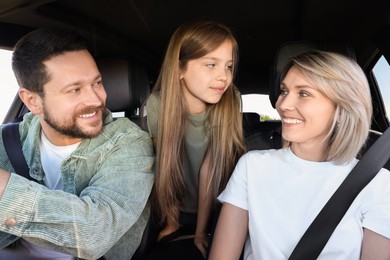 Happy family enjoying trip together by car, view from inside