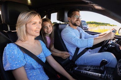 Happy family enjoying trip together by car, view from outside