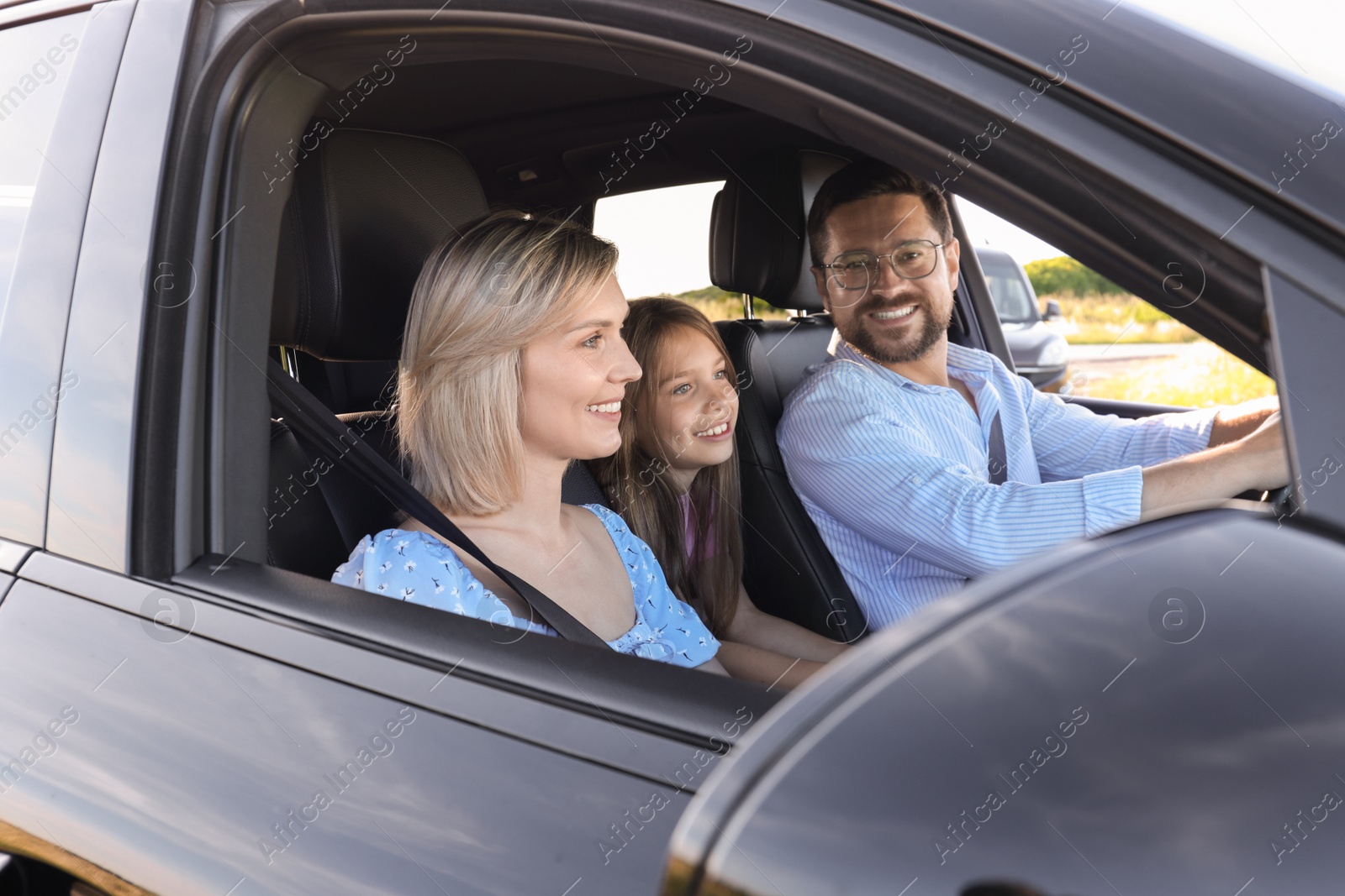 Photo of Happy family enjoying trip together by car, view from outside