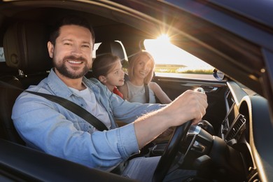 Happy family enjoying trip together by car, view from outside