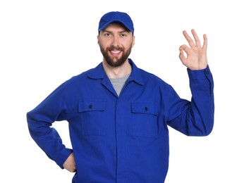 Professional auto mechanic showing OK gesture on white background