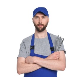 Professional auto mechanic with tools on white background