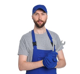 Professional auto mechanic with tools on white background