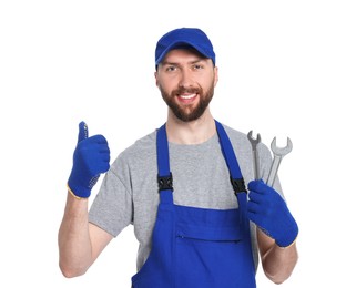 Photo of Professional auto mechanic with tools showing OK gesture on white background