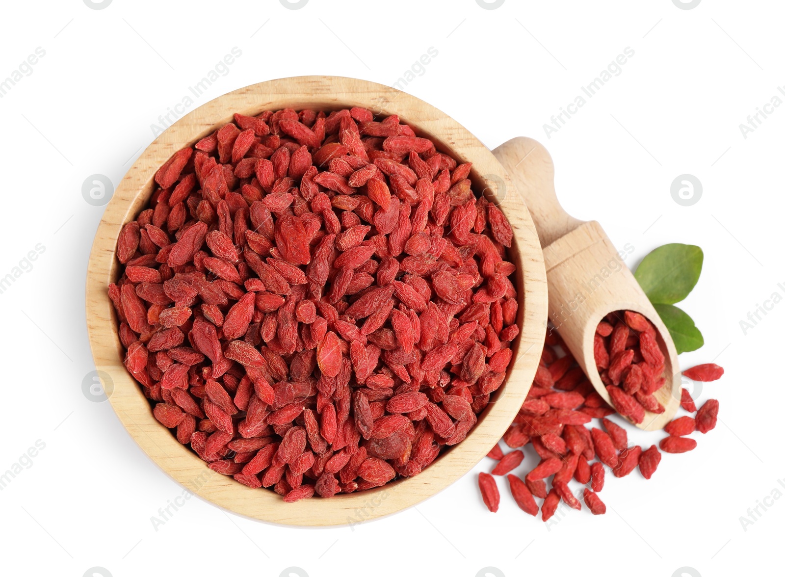 Photo of Bowl and scoop with dried goji berries isolated on white, top view