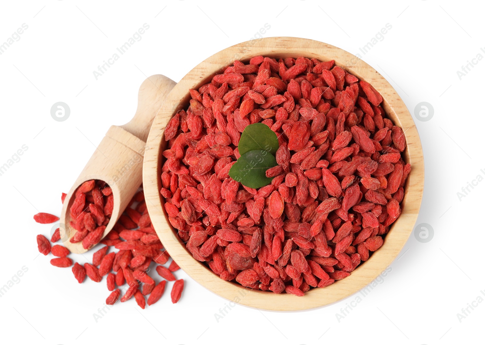 Photo of Bowl and scoop with dried goji berries isolated on white, top view