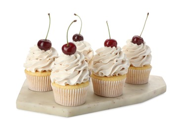 Photo of Delicious cupcakes with cream and cherries isolated on white