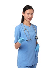 Photo of Portrait of smiling nurse holding something on white background