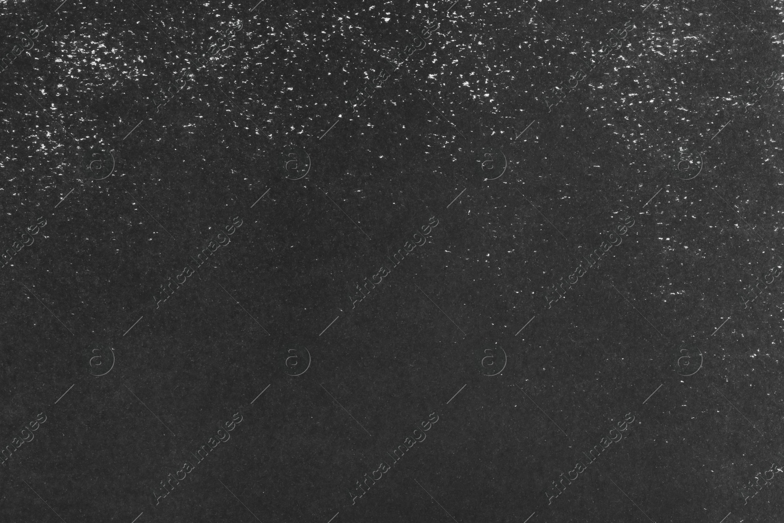 Photo of Texture of paper with black ink as background, top view