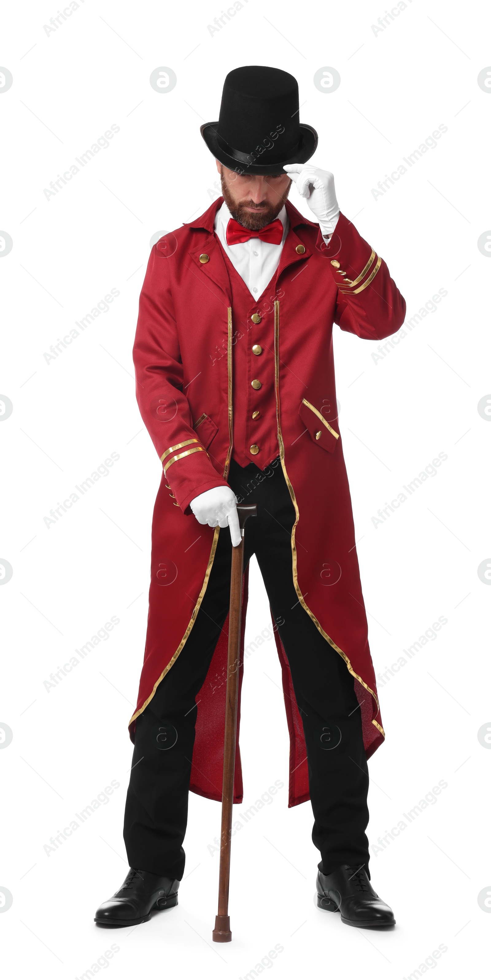 Photo of Portrait of showman in red costume and hat on white background