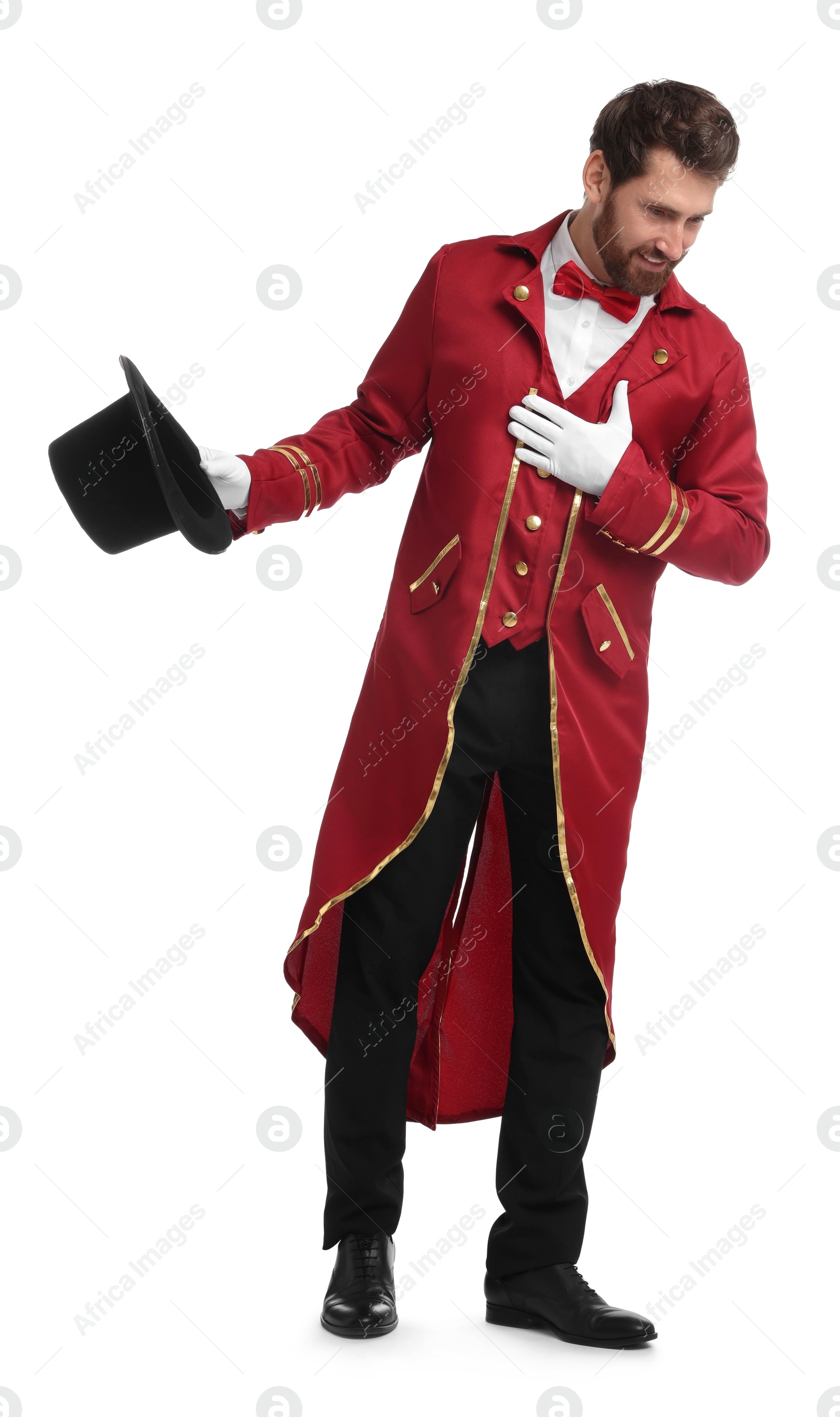 Photo of Portrait of showman in red costume and hat on white background