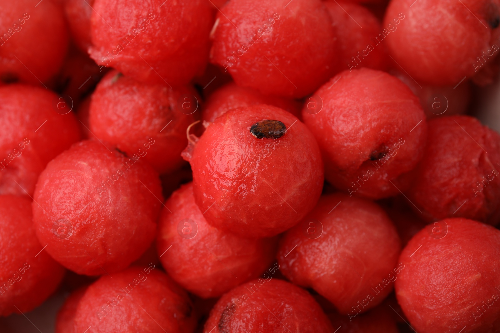 Photo of Many tasty watermelon balls as background, top view