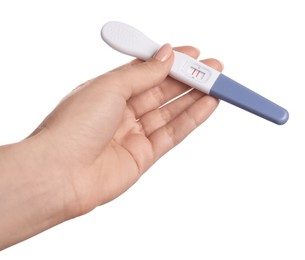 Woman holding pregnancy test on white background, closeup