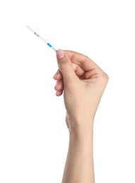 Woman holding pregnancy test on white background, closeup