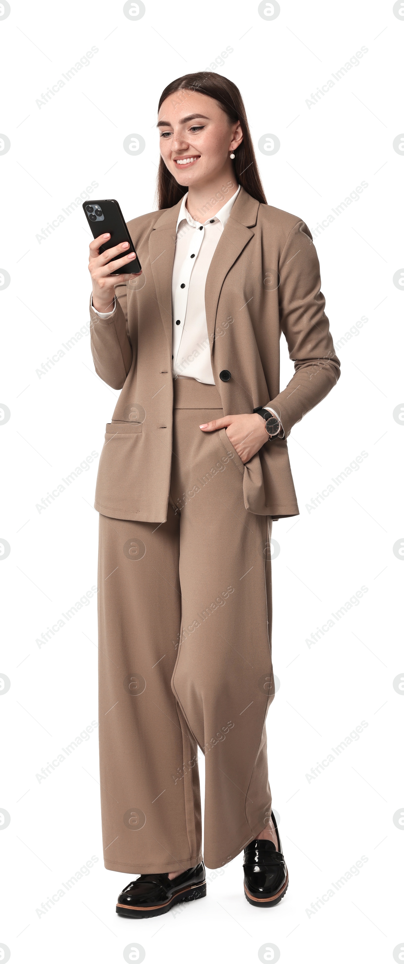 Photo of Beautiful woman in beige suit using smartphone on white background