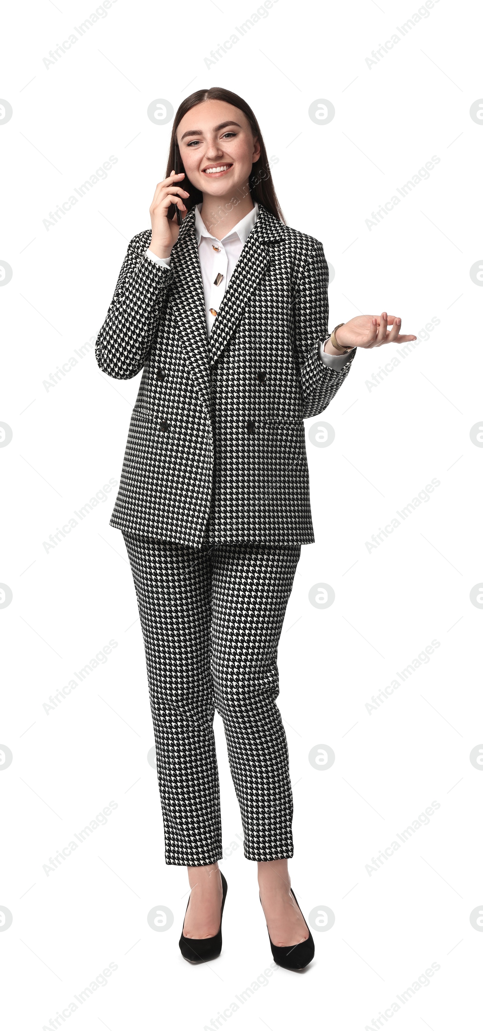 Photo of Beautiful woman in stylish suit talking on phone against white background