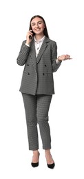 Beautiful woman in stylish suit talking on phone against white background