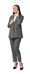 Beautiful woman in stylish suit talking on phone against white background