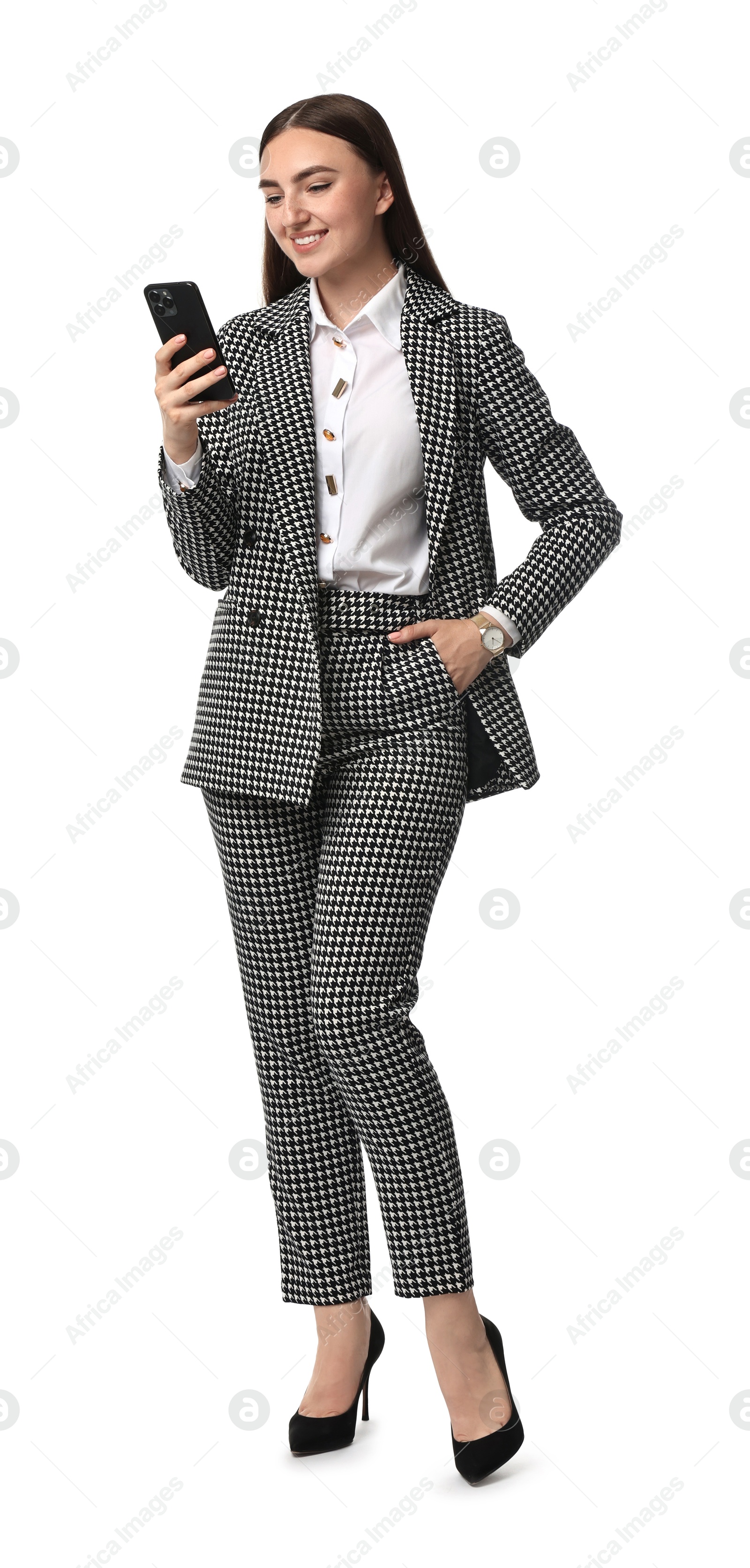 Photo of Beautiful woman in stylish suit using smartphone on white background