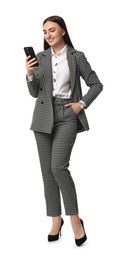 Beautiful woman in stylish suit using smartphone on white background