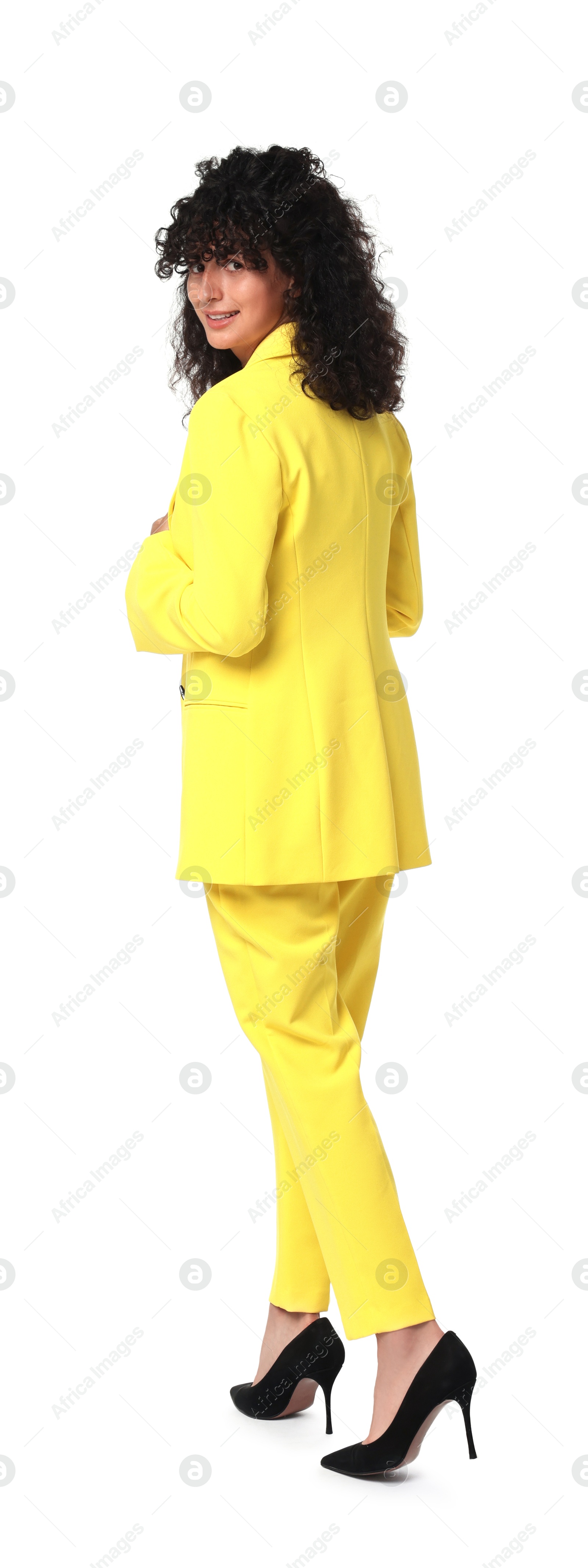 Photo of Beautiful young woman in stylish yellow suit isolated on white