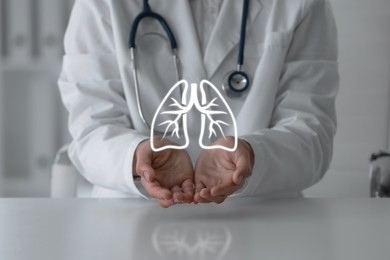 Image of Doctor holding virtual lungs at table in clinic, closeup