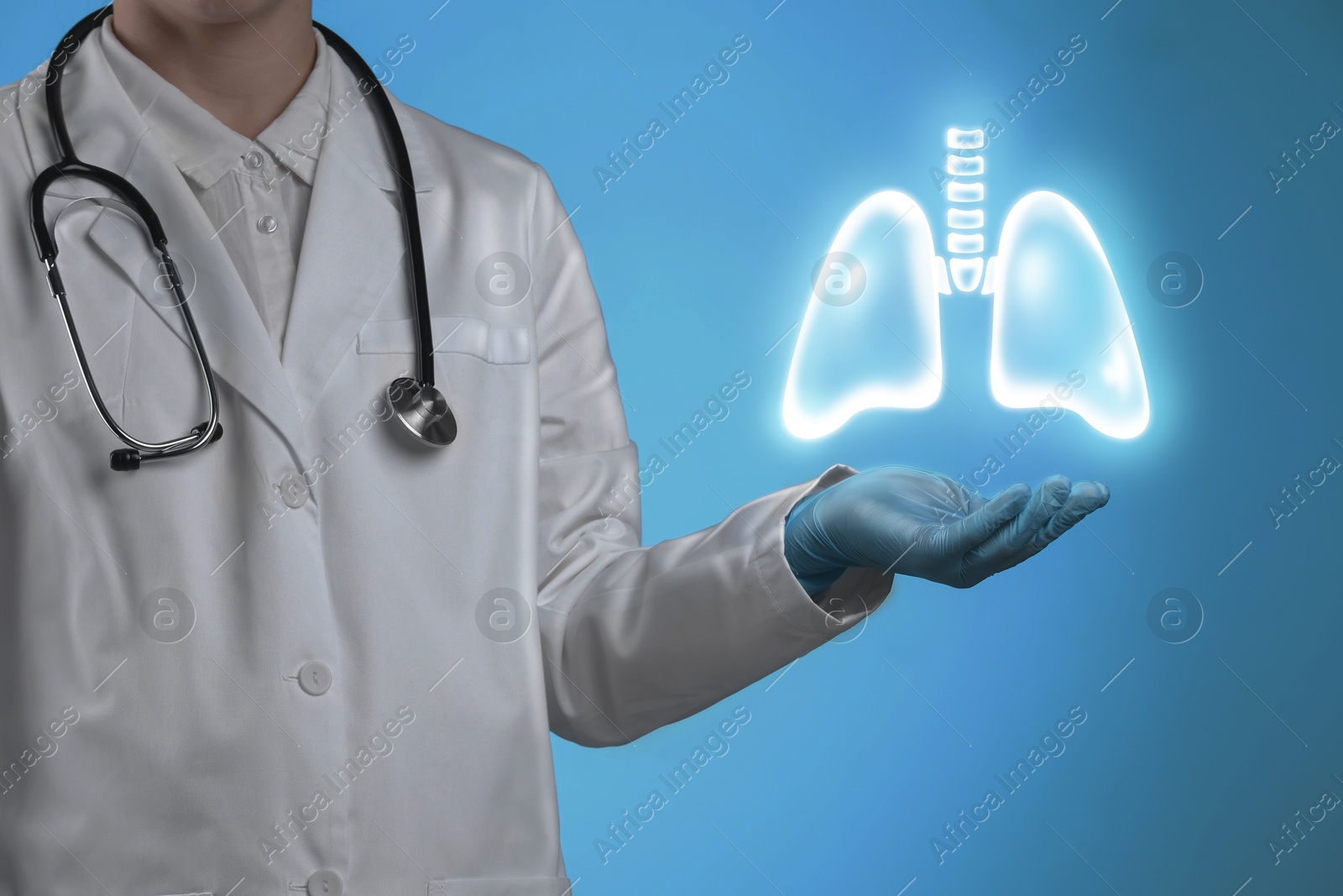 Image of Doctor holding virtual lungs on light blue background, closeup