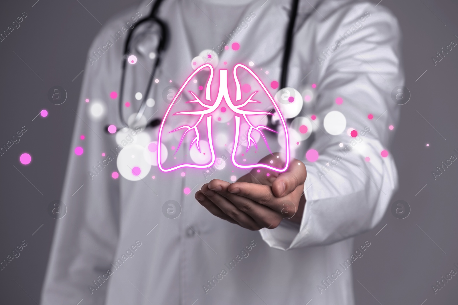 Image of Doctor holding virtual lungs on grey background, closeup