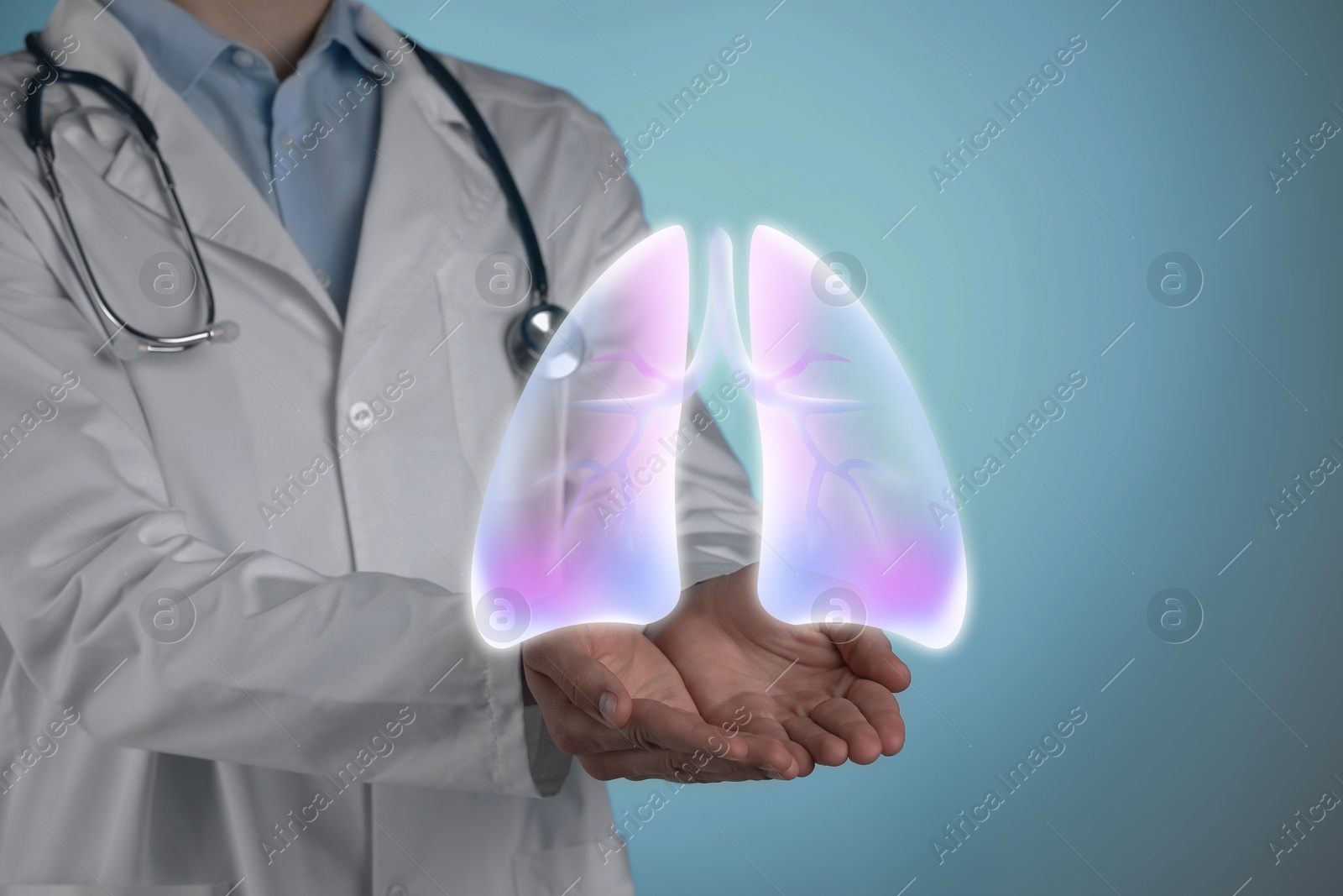 Image of Doctor holding virtual lungs on light blue background, closeup