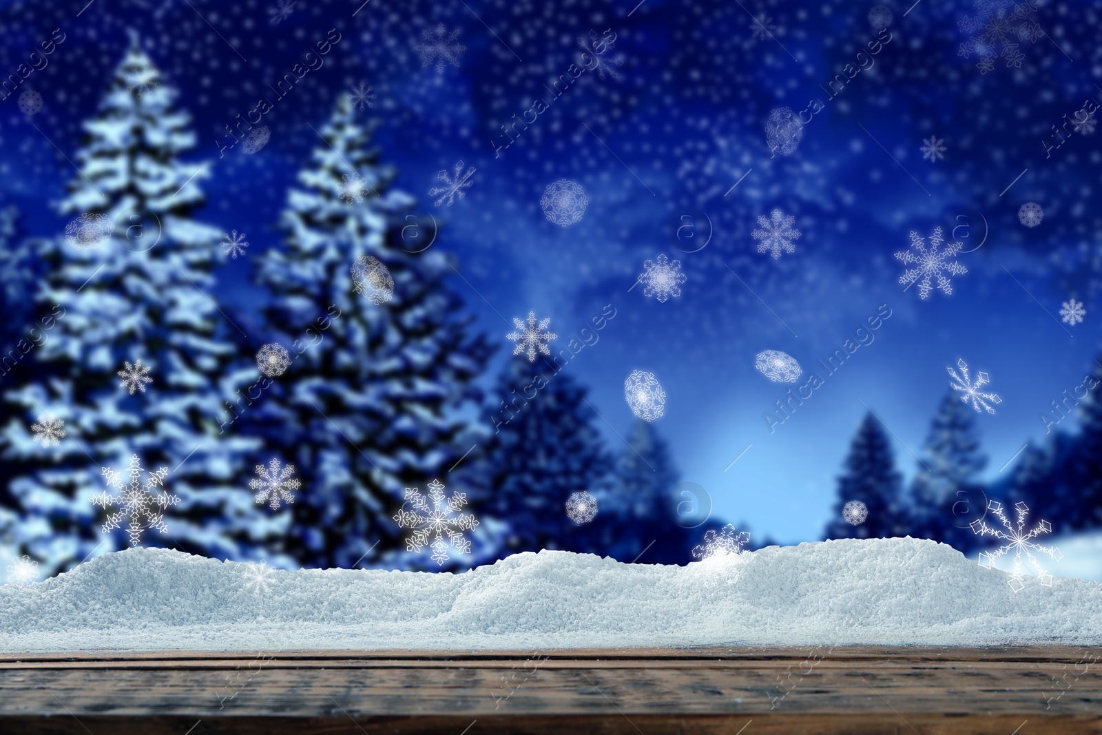 Image of Wooden table with snow in forest, space for text