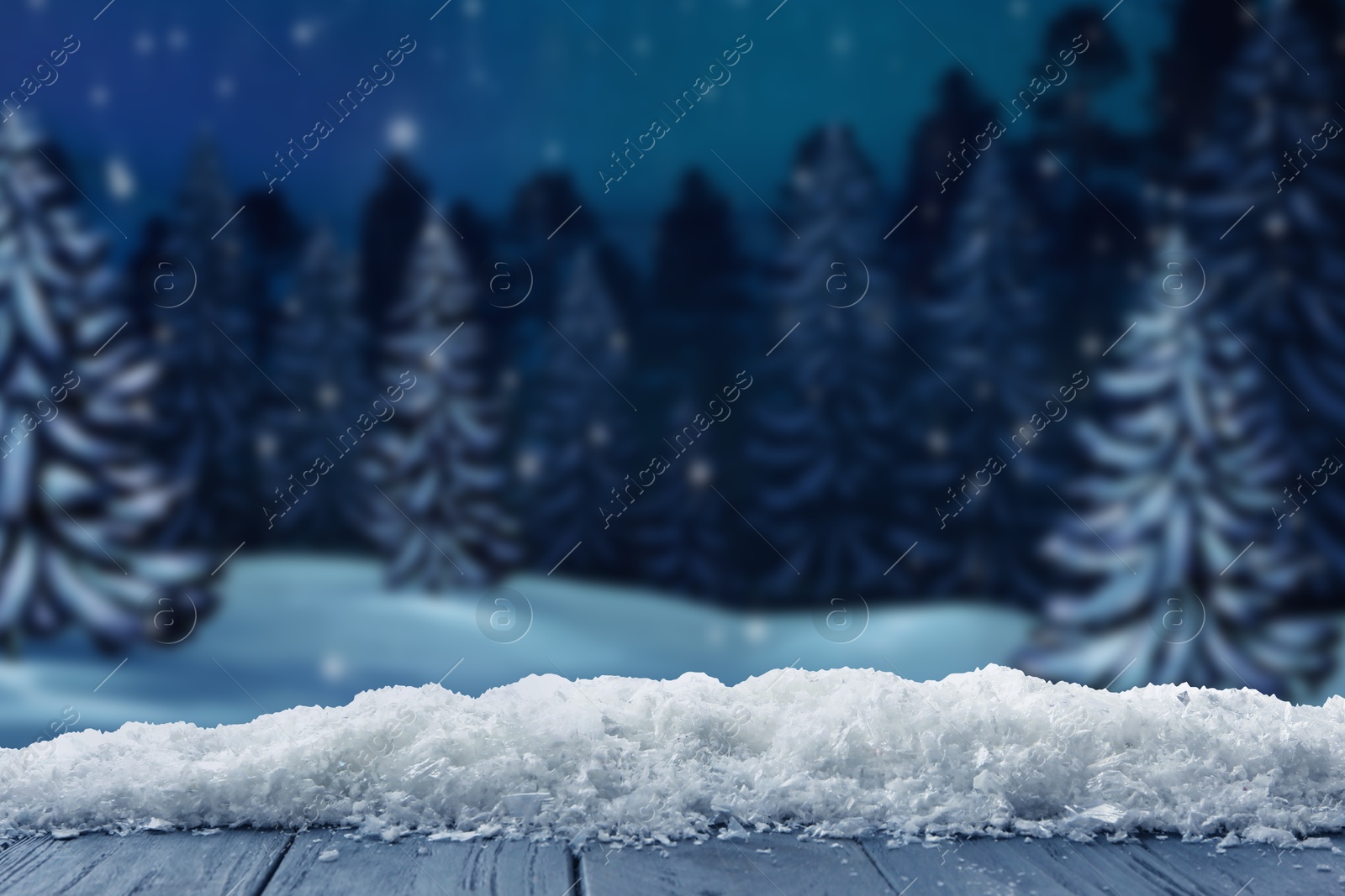 Image of Wooden table with snow in forest, space for text