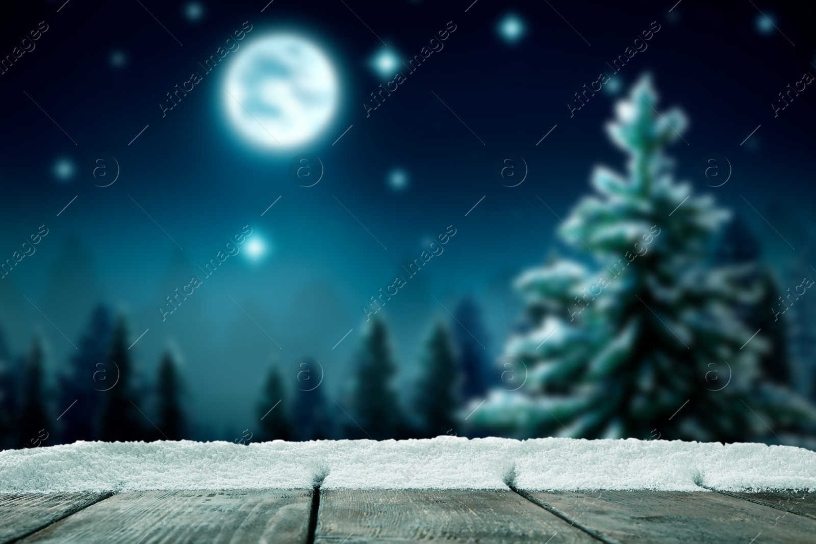 Image of Wooden table with snow in forest, space for text