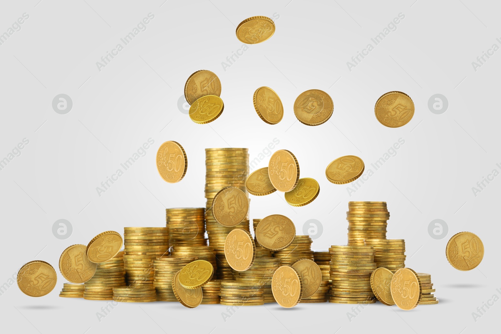 Image of Euro cent coins falling on light grey background