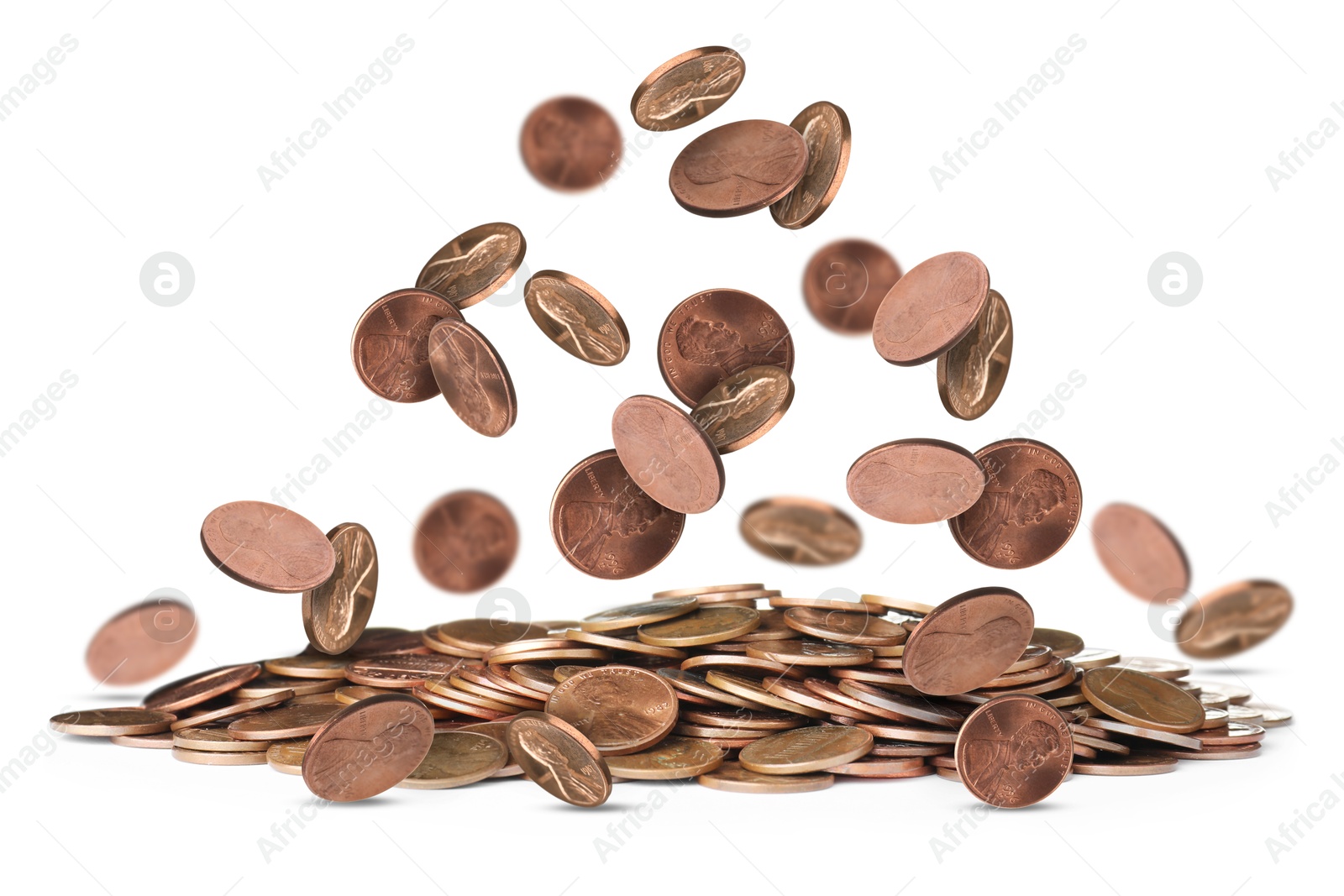 Image of United States one cent coins falling on white background