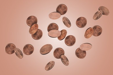 Image of United States one cent coins in air or pink rose gold background