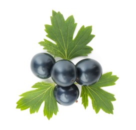 Photo of Ripe blackcurrants and green leaves isolated on white, top view