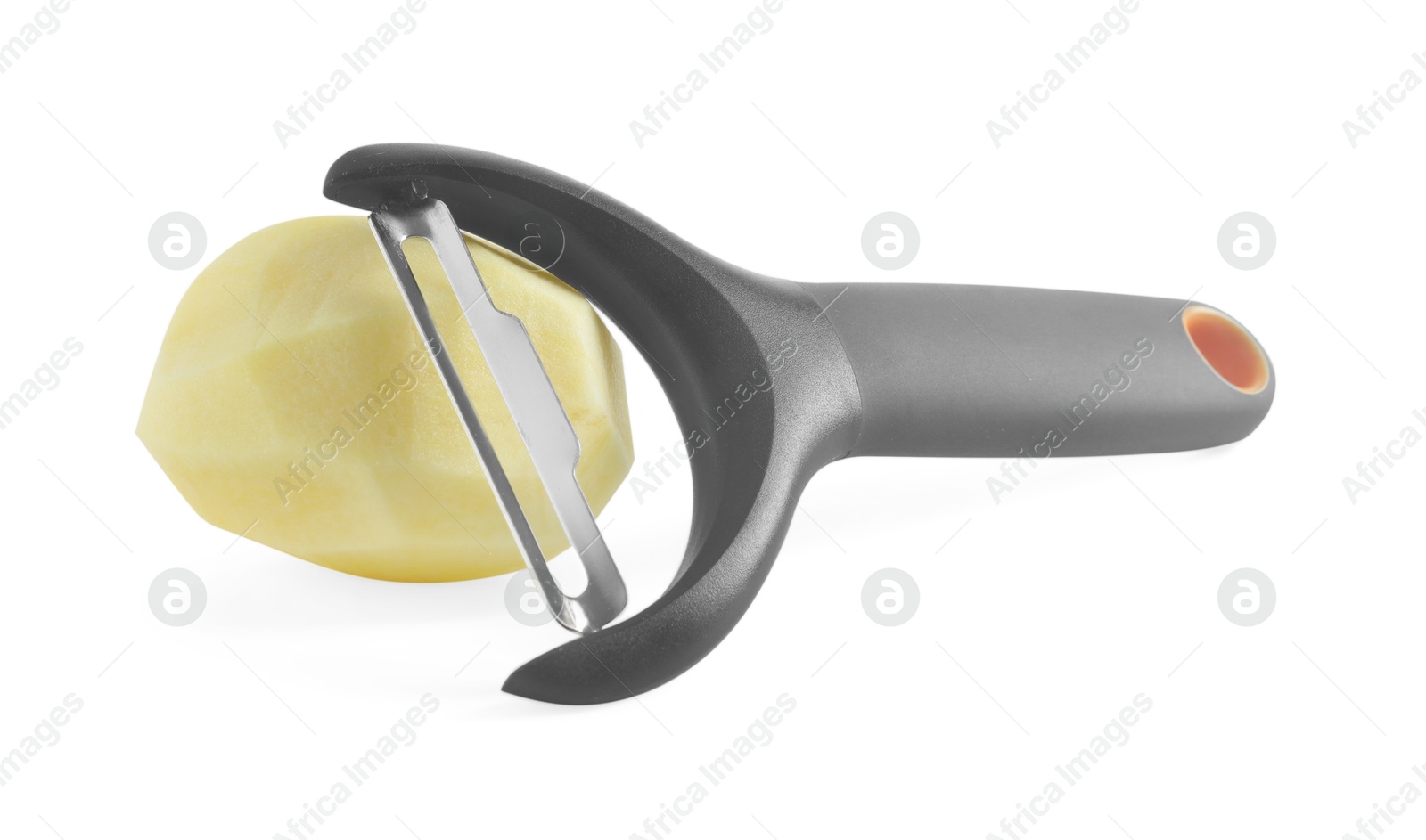 Photo of Fresh raw potato and peeler isolated on white