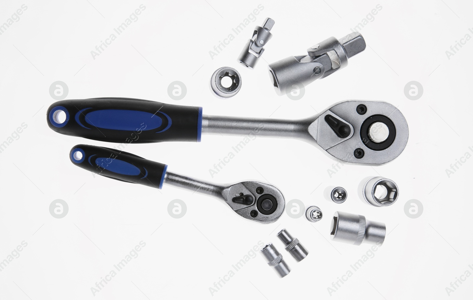 Photo of Two torque wrenches and nuts on white, flat lay. Auto mechanic tools