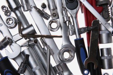 Photo of Set of auto mechanic's tools on white background, flat lay