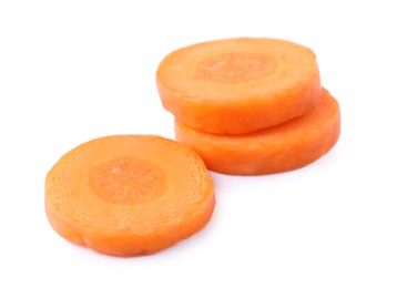 Photo of Slices of fresh ripe carrot isolated on white