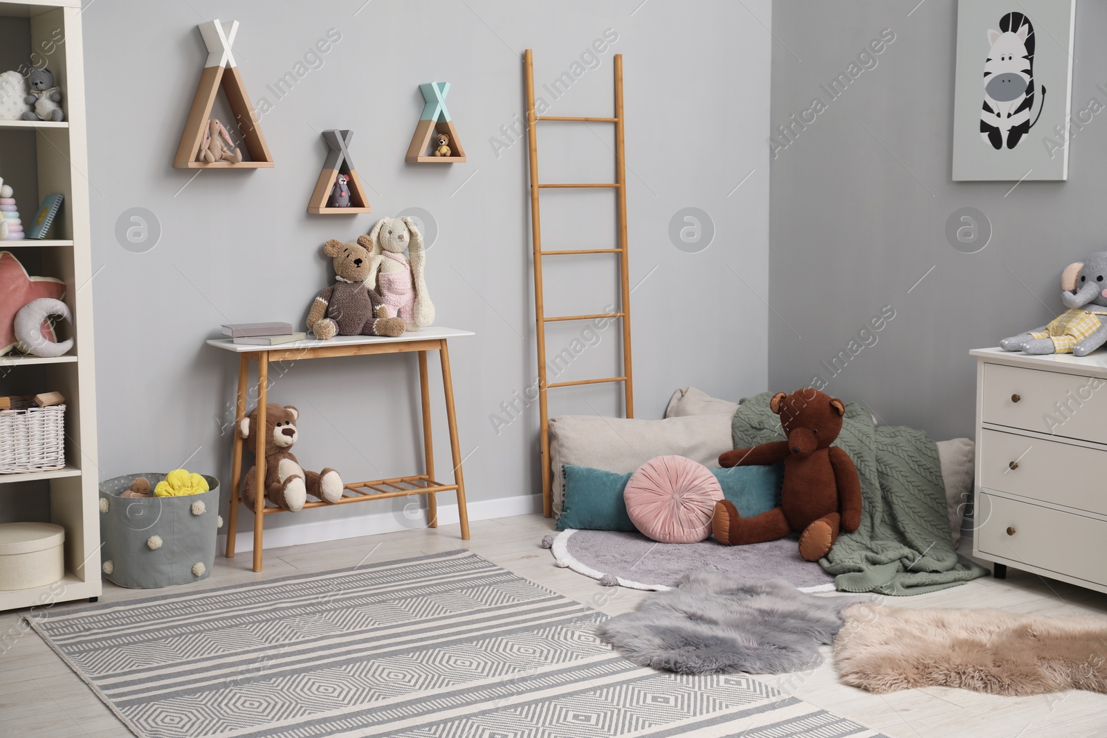 Photo of Stylish child room interior with modern furniture and toys