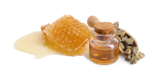 Photo of Natural honey tincture, propolis granules and sweet honeycomb isolated on white