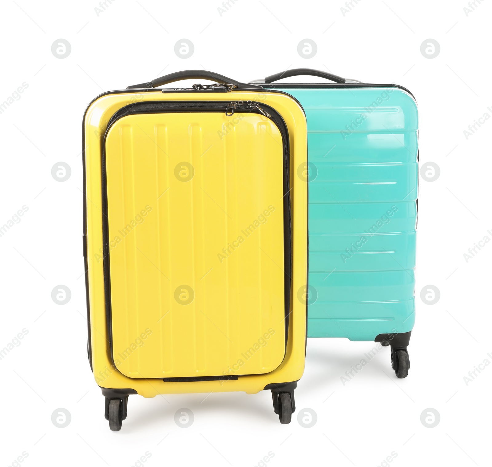 Photo of Two new yellow and light blue suitcases isolated on white