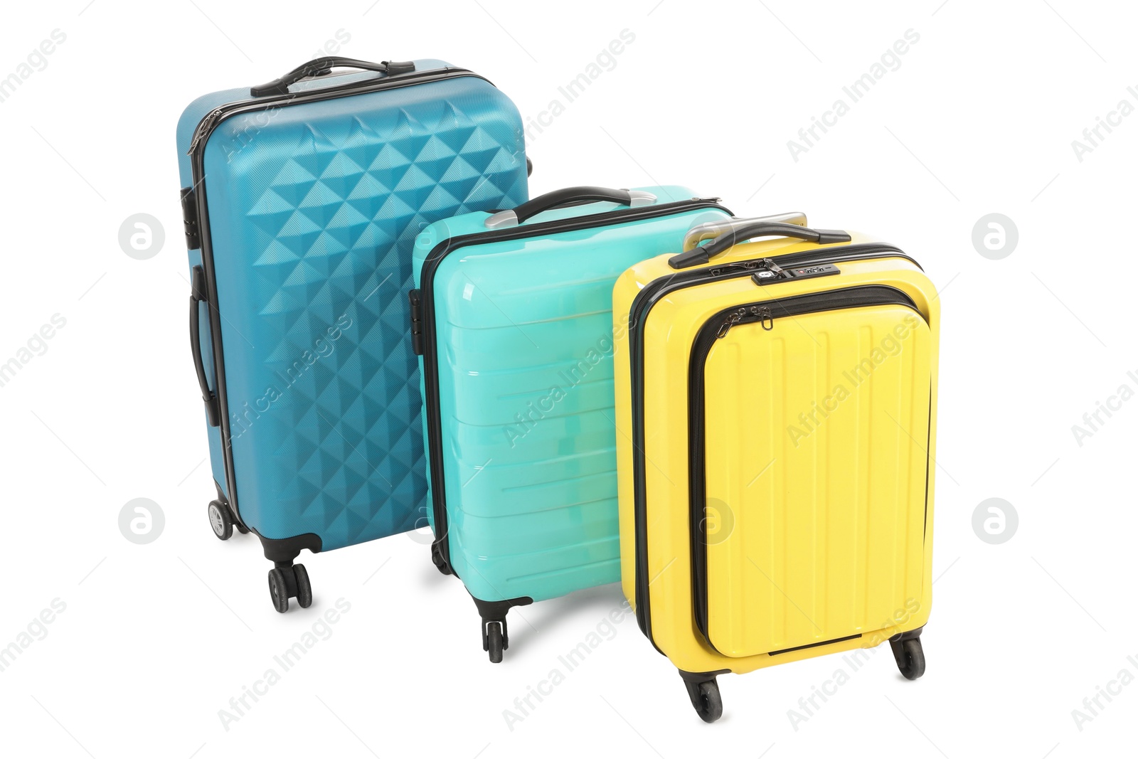 Photo of New yellow and light blue suitcases isolated on white