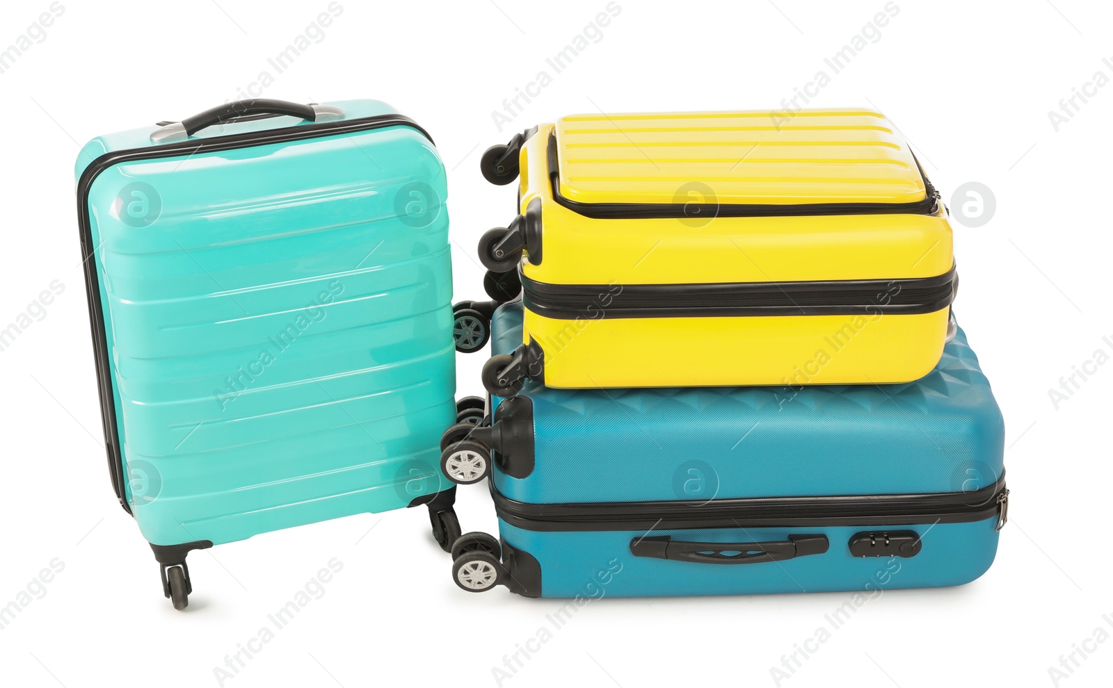 Photo of New yellow and light blue suitcases isolated on white