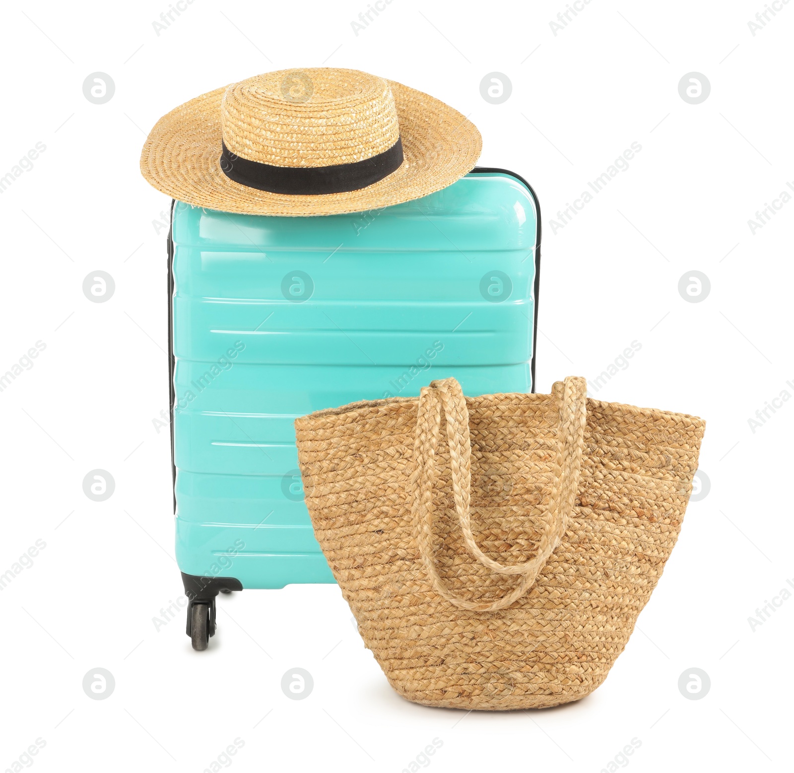 Photo of Light blue suitcase, bag and straw hat isolated on white