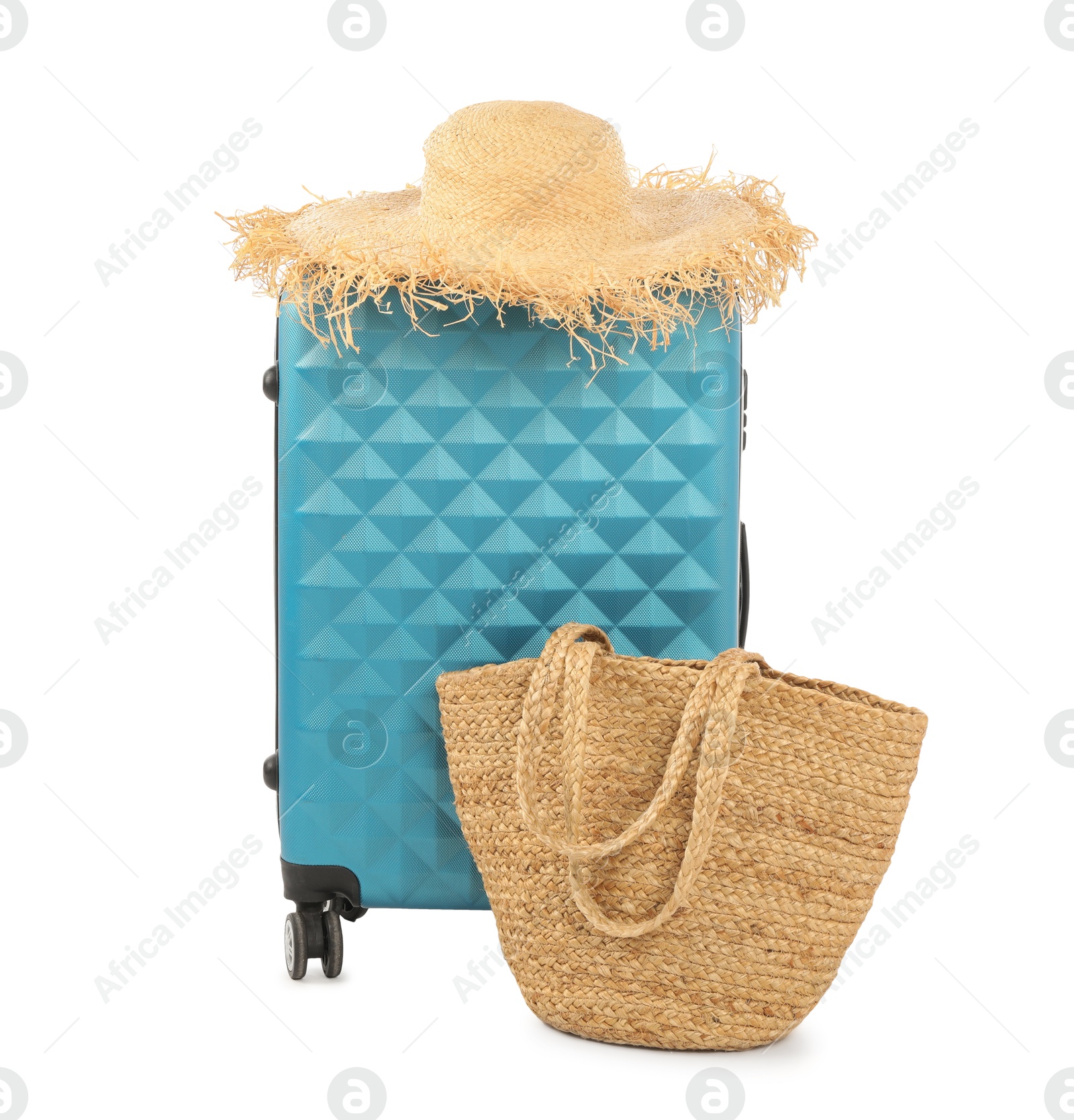 Photo of Light blue suitcase, bag and straw hat isolated on white